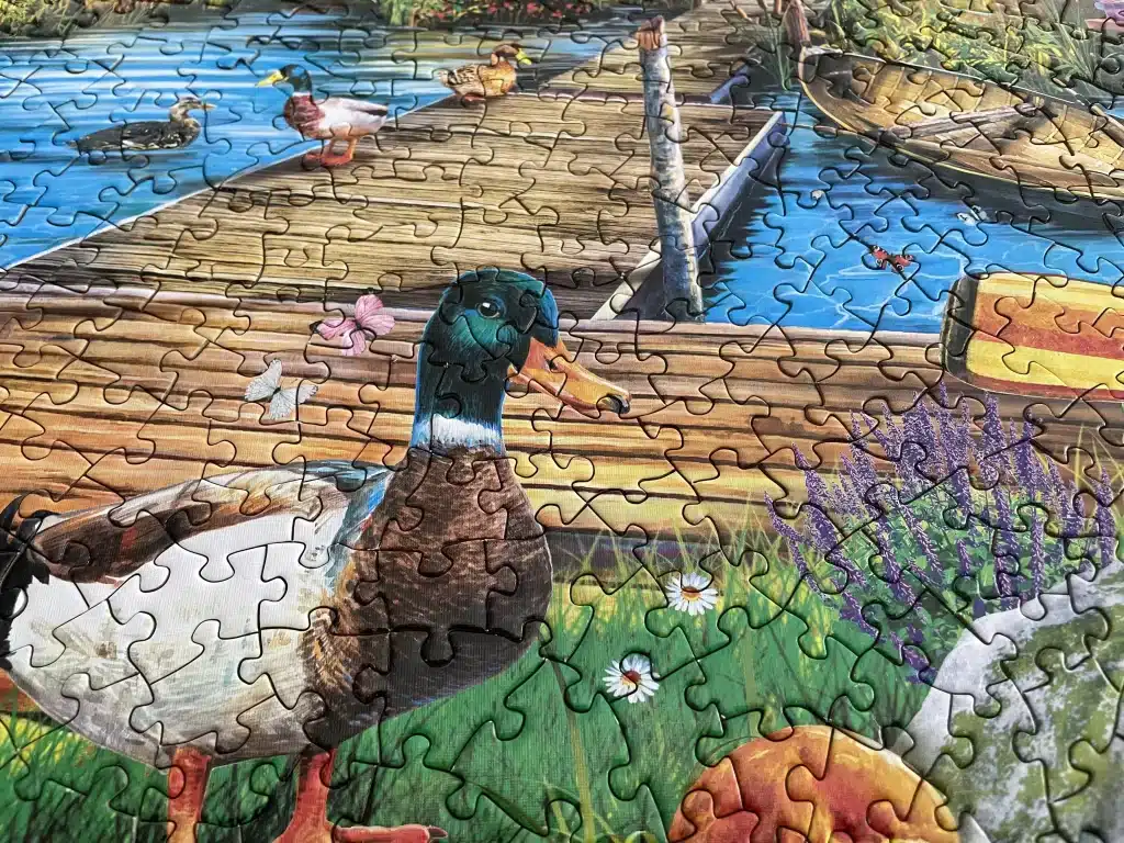 MasterPieces Island Cabin Retreat 1000 Piece Jigsaw Puzzle closeup duck
